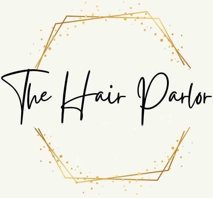 Elegant logo of "The Hair Parlor" with gold splatters and hexagonal outline.